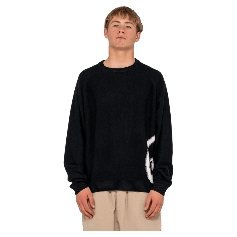 View of man in Rusty Verso Knitted Crew in colour Black