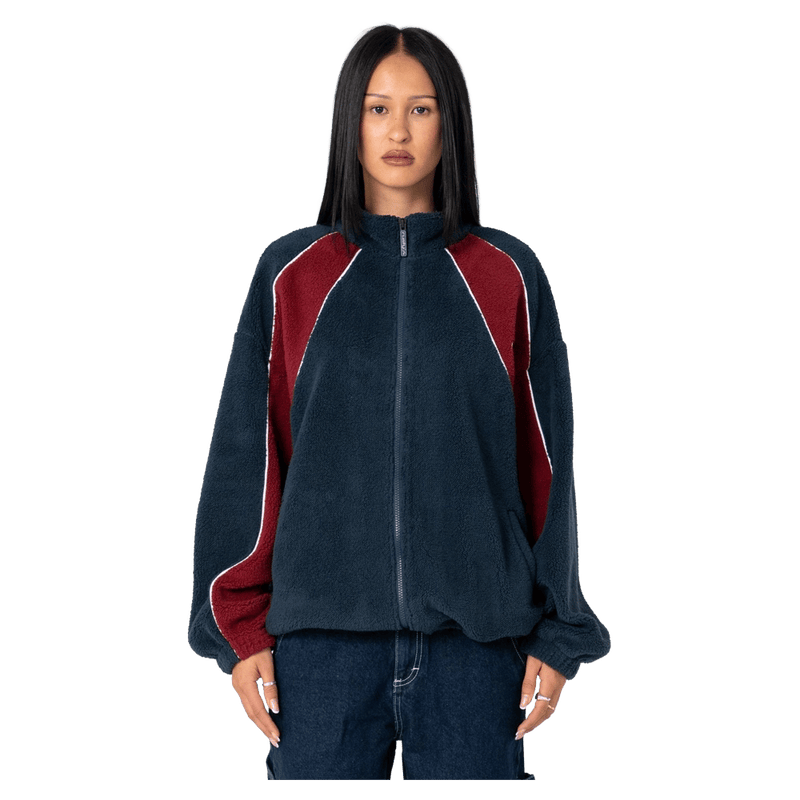 View of women in Rusty Two Tides Zip Through Sherpa Fleece in colour Navy/Red