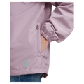 Pocket view of the XTM Stash 2L Rain Jacket in Fog colourway, unisex's model