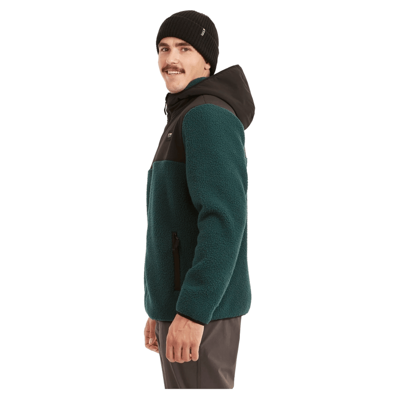 Side view of the XTM Treachery Fleece Jacket in Pine colourway, unisex's model