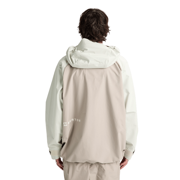 Back view of a beige and off-white Analog Hardpack 3L Snowboard Jacket with a hood and small Burton logo.