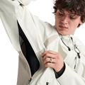 Analog Hardpack 3L Snowboard Jacket in off-white showing the open underarm ventilation zipper and technical fabric.