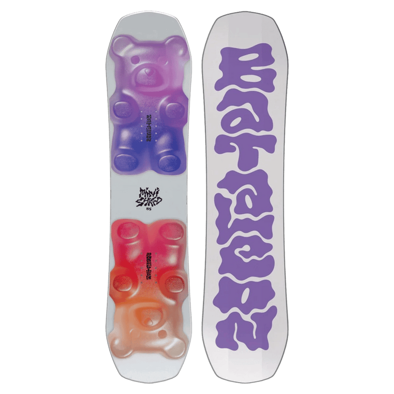 Bataleon Minishred kids snowboard with white top, purple and orange gummy bear graphics, and purple logo on the base.
