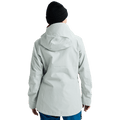 Rear view of a light grey Burton AK Upshift Gore-Tex 2L women's snowboard jacket with a hood and black beanie.