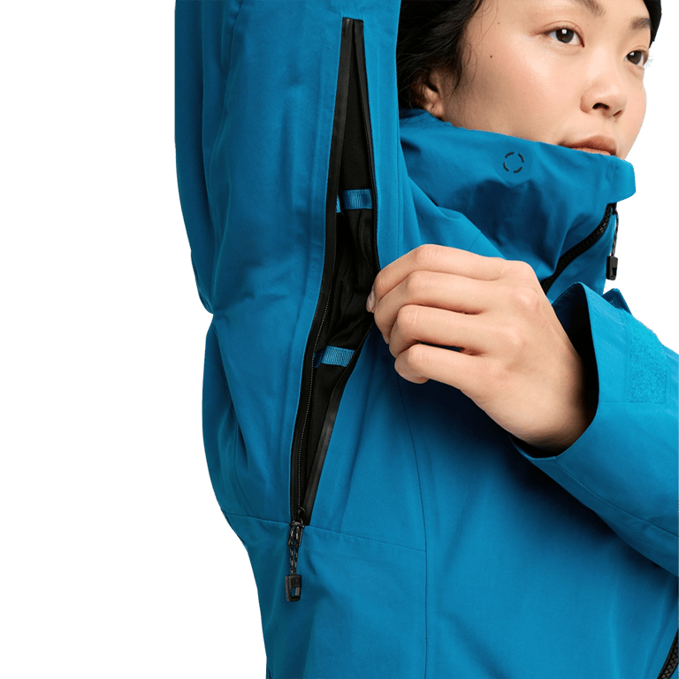 Underarm pit zip vent on a bright blue Burton AK Upshift Gore-Tex women's snowboard jacket.