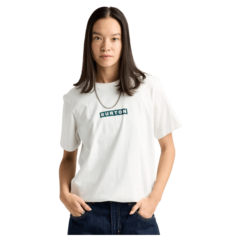 Woman wearing a white Burton Dejaview short-sleeve t-shirt with a green rectangular logo on the chest.