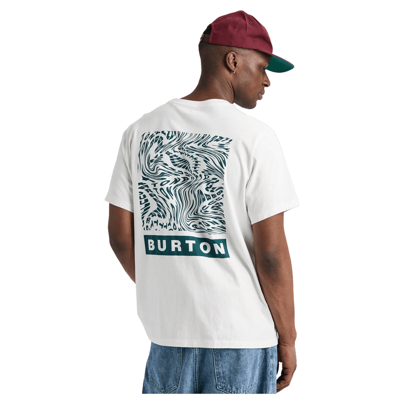 White Burton Dejaview short-sleeve t-shirt featuring a teal wavy back graphic and logo, worn by a man in a cap.