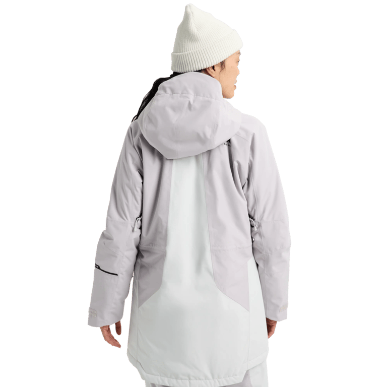 Back view of a women's Burton Reserve Insulated Snowboard Jacket in lavender and white with a hood and white beanie.
