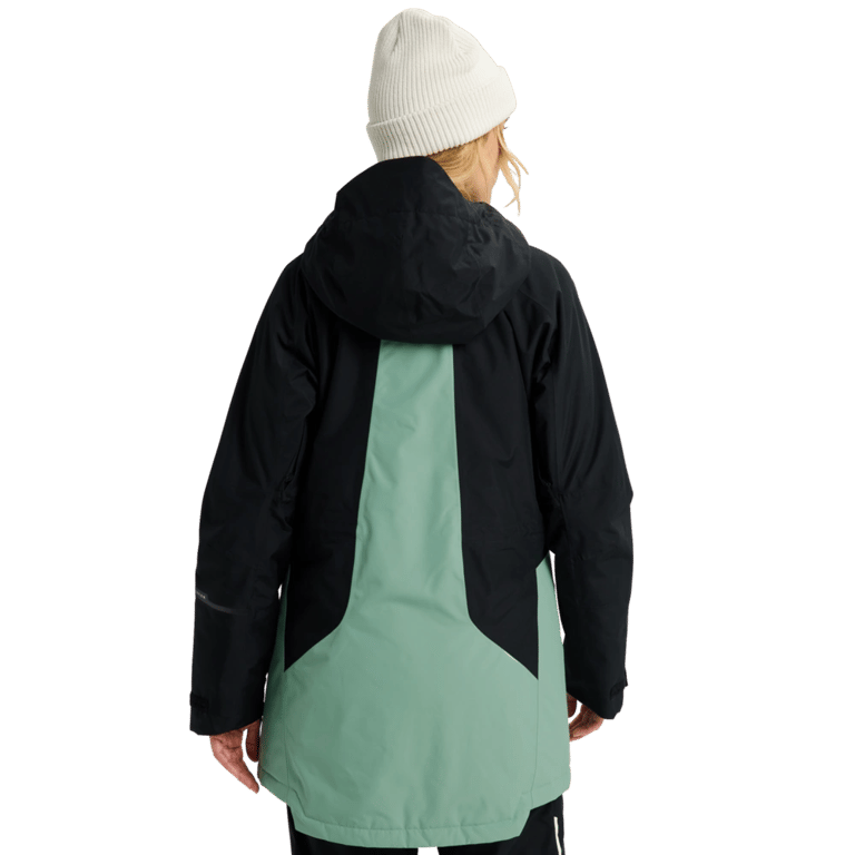 Back view of a black and sage green Burton Reserve Insulated Snowboard Jacket with a hood and white beanie.