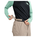 Close-up of tan Burton Reserve Insulated Snowboard Pants showing the adjustable velcro waist strap.