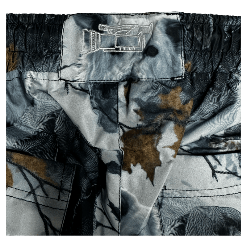 Logo view of the CHECKthefeed VX Classic Snowboard Pants - Dog Snow Camo Print CTF-VXCLASSICPANTSDOG Pants, 26/27 Unisex's model