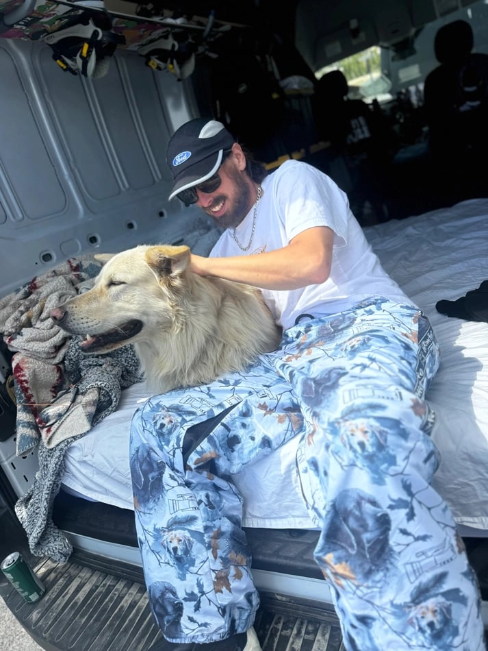 Dog1 view of the CHECKthefeed VX Classic Snowboard Pants - Dog Snow Camo Print CTF-VXCLASSICPANTSDOG Pants, 26/27 Unisex's model