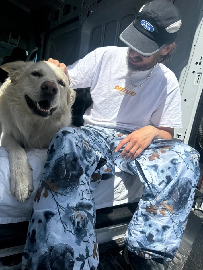 Dog4 view of the CHECKthefeed VX Classic Snowboard Pants - Dog Snow Camo Print CTF-VXCLASSICPANTSDOG Pants, 26/27 Unisex's model