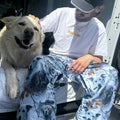 Dog4 view of the CHECKthefeed VX Classic Snowboard Pants - Dog Snow Camo Print CTF-VXCLASSICPANTSDOG Pants, 26/27 Unisex's model