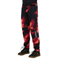 Dharco Gravity Kids mountain bike pants with red and black abstract print, tapered legs, and white logo on the side.