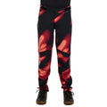 Dharco Kids Gravity Pants in black with a red abstract pattern, featuring a tapered fit and reinforced knees.