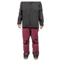 Maroon Endeavor 3L Shelter Bib Snowboard Pants with zippered pockets, worn with a black jacket and snowboard boots.