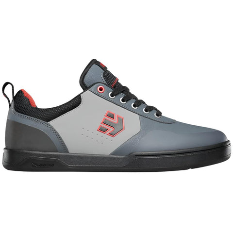 Grey mountain bike shoes with red details.