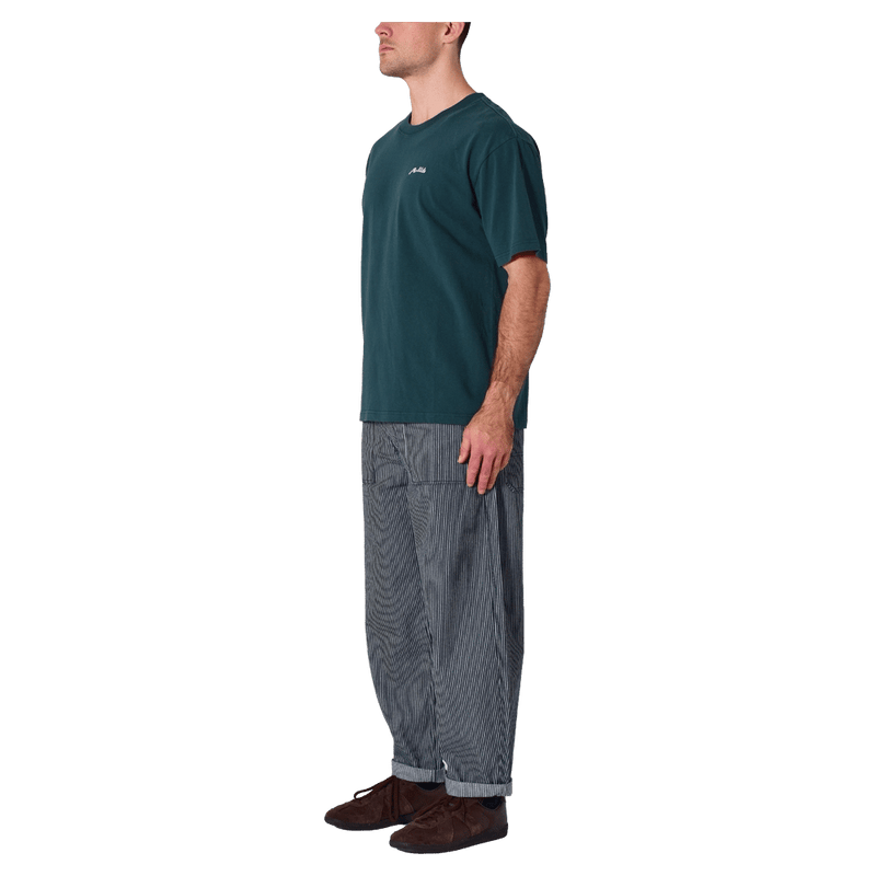 Side view of man in the Rollas Ezy Classic Tee in Colour Washed Pine