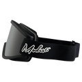Side profile of black Modest Team XL Goggles with a grey lens and white script logo on the black strap.