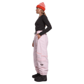 Side view of women wearing the Rojo Nine Oh Ski Pants - Womens in Pink-a-boo.