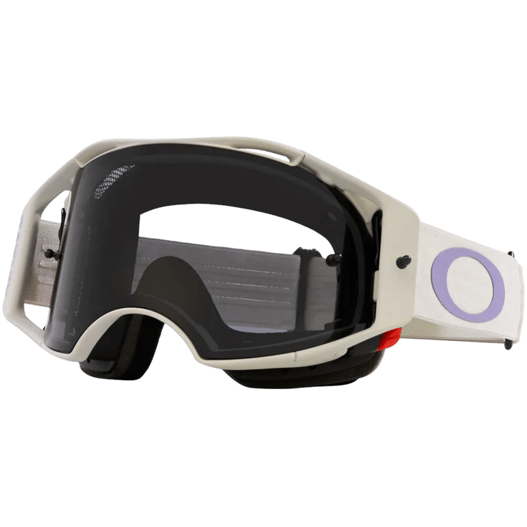 Oakley Airbrake MTB goggles in off-white with a dark grey lens and a white strap featuring a purple logo.