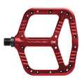 Red One Up Components Wave flat mountain bike pedal with thin aluminum platform and metal traction pins.