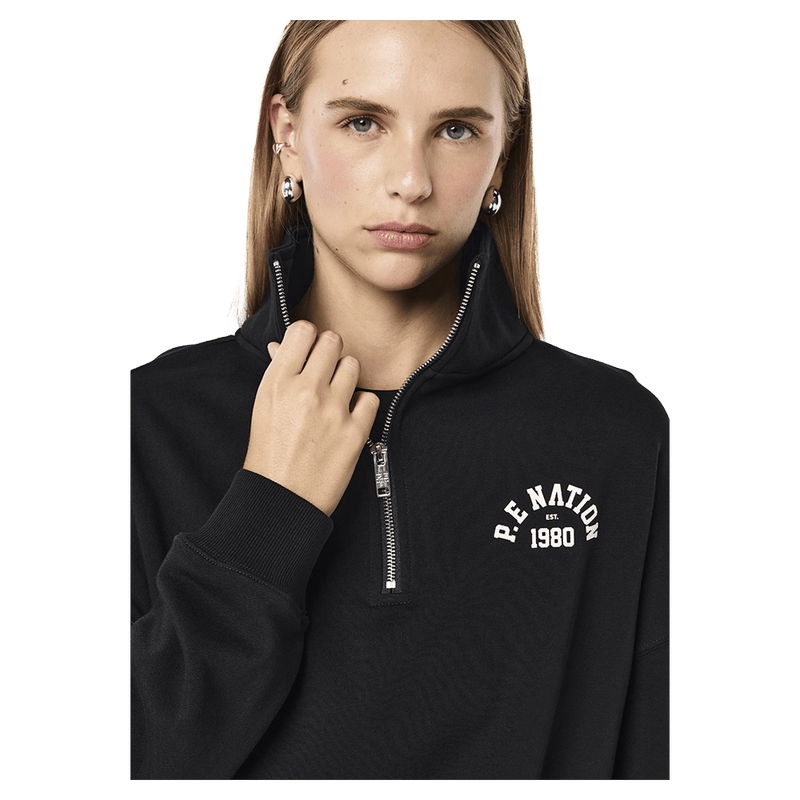 Close view of the PE NATION Established Oversized Quarter Zip Black Sweater, 26/27 Womens's model