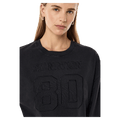 Close view of the PE NATION Oversized LS Washed Black Tee, 26/27 Womens's model
