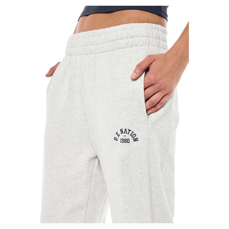 Close Side view of the PE NATION Swerve Tackpant Grey Marle Pants, 26/27 Womens's model