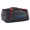Main view of the Patagonia Black_Hole_Duffel_55L_Smolder Blue w/Amanita Red 49348 Bags, 26/27 Unisex's model