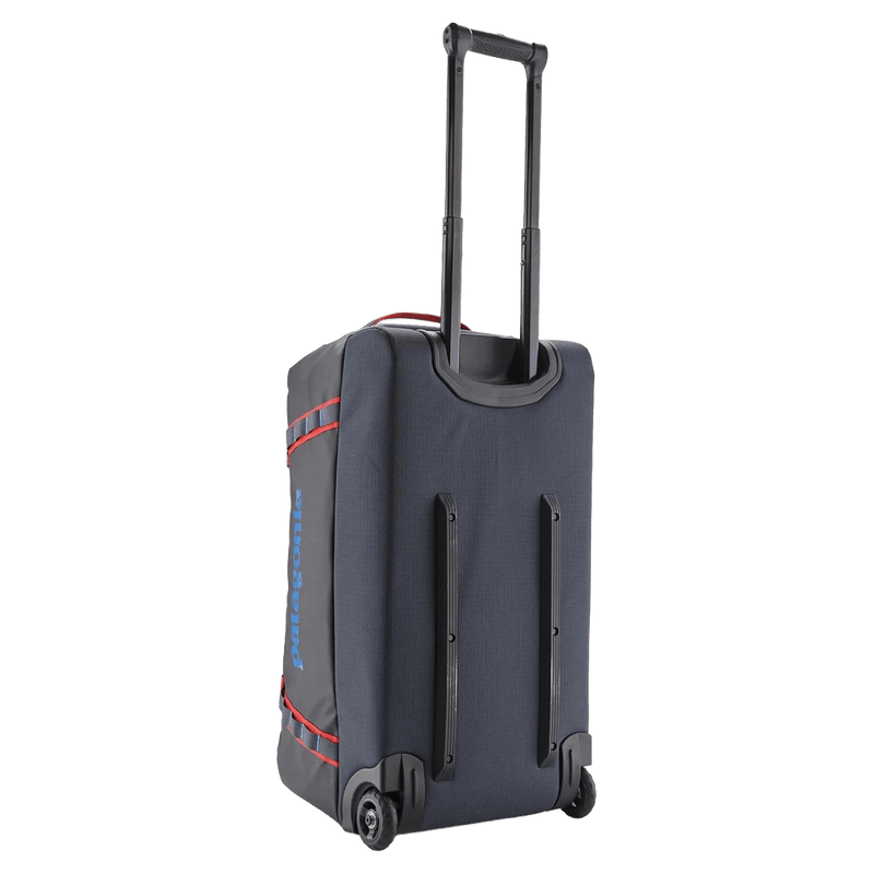 Upright view of the Patagonia Black Hole®_Wheeled_Duffle_70L_SmolderBlue_AnimatedRed 49382 Bags, 26/27 Unisex's model