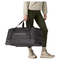 Carried view of the Patagonia Black Hole®_Wheeled_Duffle_70L_Black 49382 Bags, 26/27 Unisex's model