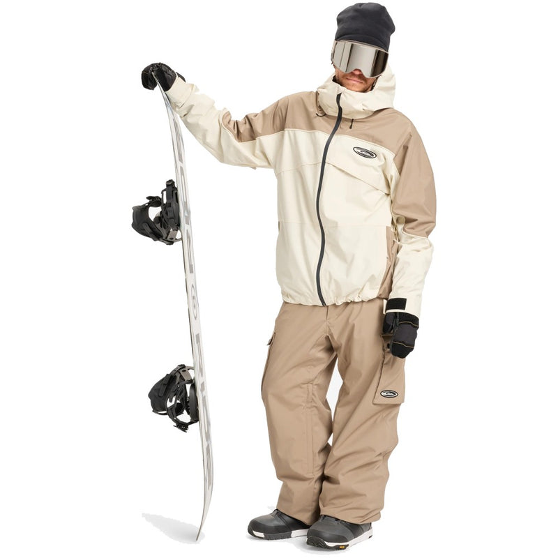 Front view of a tan and cream Quiksilver Radicalo Snowboard Jacket with a full-zip front and hood on a model.