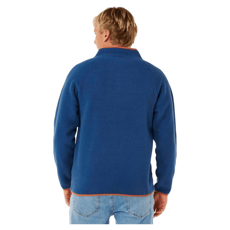 Blue Rip Curl Heritage Polar Fleece jumper with orange trim, back view on a man.