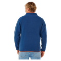 Blue Rip Curl Heritage Polar Fleece jumper with orange trim, back view on a man.