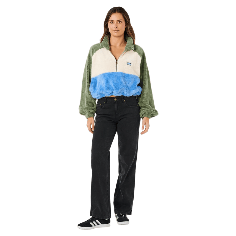 Rip Curl Hotel Malibu half-zip polar fleece jumper with green, cream, and blue color-block panels on a woman.