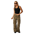 Rip Curl Paradise Camo Cargo Pant in olive green floral print with wide legs and side pockets on a model.