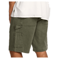 Side cropped view of a man wearing the Bad Dog Workwear Shorts from Billabong in Dark Military. Featuring a utility loop and tool pocket to the side.