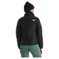 Rear view of a woman wearing The North Face Terra Peak Jacket for Women in Black featuring a short stand collar and a heat transfer white logo on the left shoulder