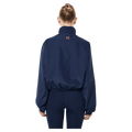 Back view of the PE NATION Shield Dark Navy Jacket, 26/27 Womens's model