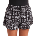 Cropped view of a girl wearing the Lost On You Swim Volley - Kids from Billabong in Black. Featuring a gathered elastic waist with drawstring and a mixed abstract print in white, with gold embroidered branding on the lower left hem