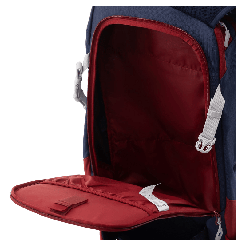 Pocket view of the Dakine Heli Pro 24L Backpack in NAVAL ACADEMY colourway, unisex's model