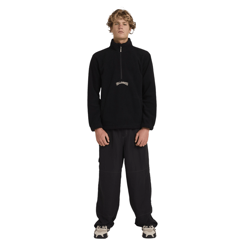 Front view of man wearing the Billabong Boundary Mockneck Jumper in Black