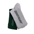 View of the Santa Cruz SC Hollow Strip Sock featuring two folded socks one green and one white with jacquard strip branding in contrast thread.