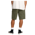 Rear cropped view of a man wearing the Bad Dog Workwear Shorts from Billabong in Dark Military.