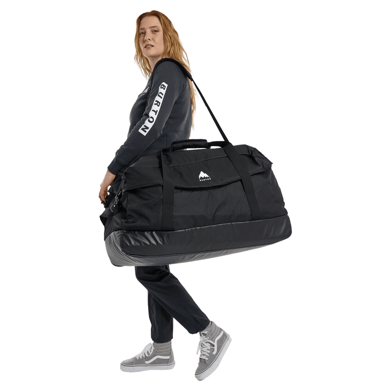 In action view of the Burton Flight Attendant 90L Duffle Bag in True Black colourway, unisex's model