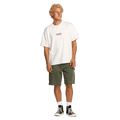 Front view of a man wearing the Bad Dog Workwear Shorts from Billabong in Dark Military.