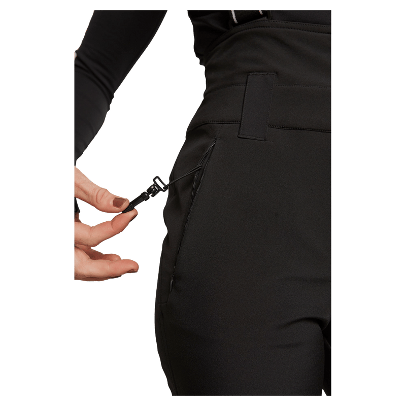 Side view of women wearing theRojo Softshell High Rise Ski Pants - Womens in colour True Black