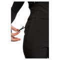 Side view of women wearing theRojo Softshell High Rise Ski Pants - Womens in colour True Black